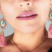 woman wearing silver necklace and earrings
