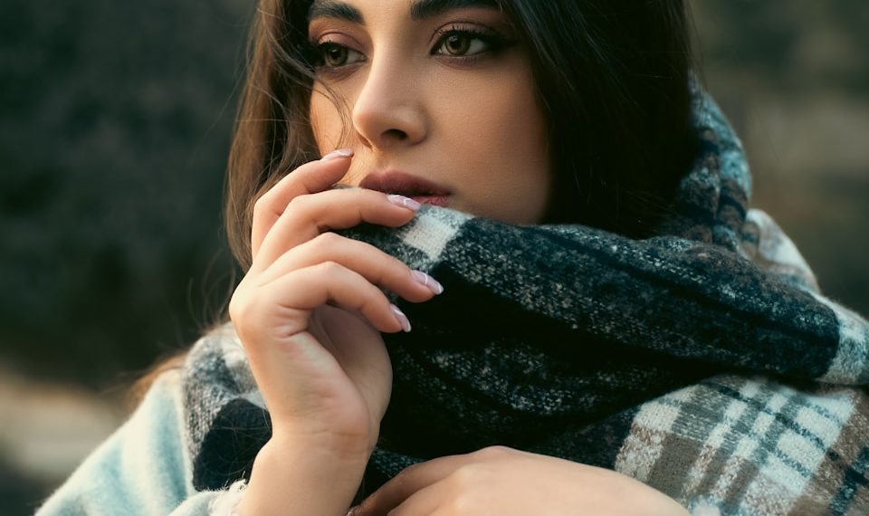 a woman with a scarf around her neck