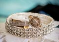 a close up of two rings on a white cloth
