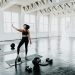 a woman is doing exercises in a gym