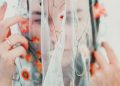 woman in white red and green floral dress
