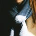 woman wearing brown top and black scarf