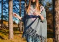 woman standing surrounded by tress