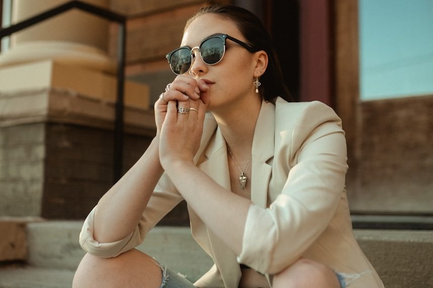 a woman sitting on the steps of a building