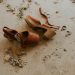 pair of brown ankle-strap sandals on floor
