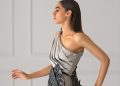 woman in gray one shouldered mini dress