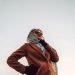 woman wearing brown peaked-lapel topcoat